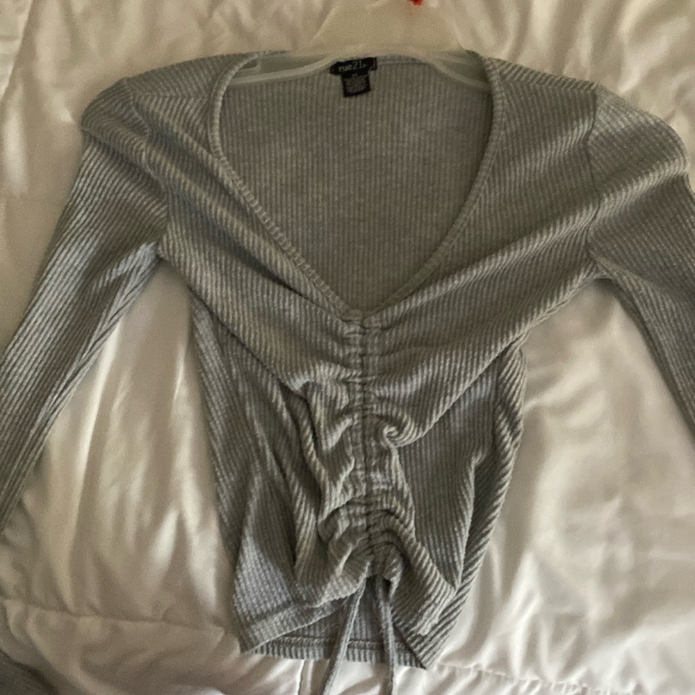 Adjustable top very low v neck but can be adjusted up rue 21